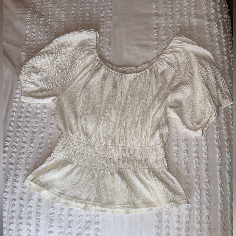 White peplum style top